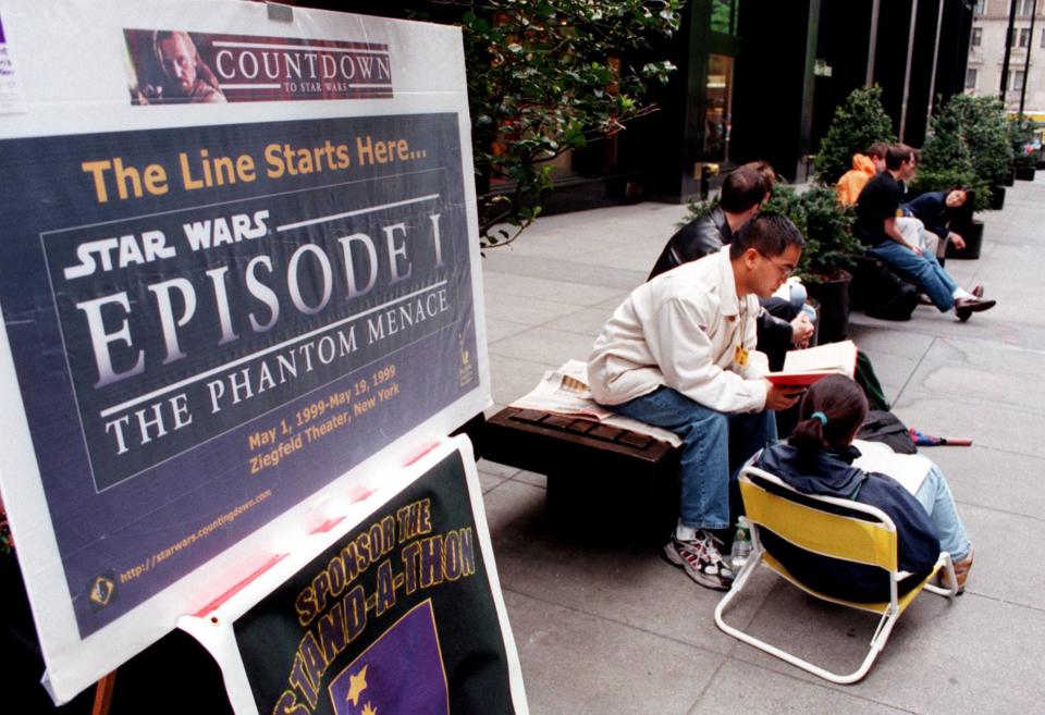 Fans line up at the Ziegfeld Theatre in New York on May 6, 1999, to be the first to see the movie, "Star Wars: Episode 1- The Phantom Menace" which is scheduled to open May 19, 1999. A group of people who sit in 4-hour shifts have been in line since May 1, 1999.
