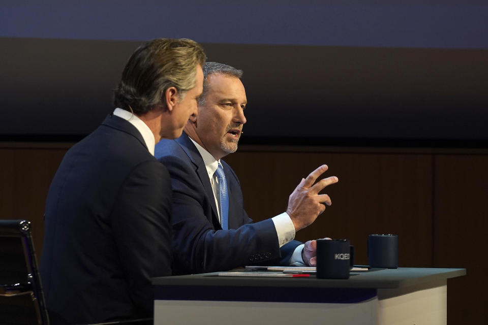 State Sen. Brian Dahle, the Republican candidate for governor, right, responds to a question during a gubernatorial debate with incumbent Democratic Gov. Gavin Newsom, left, held by KQED Public Television in San Francisco, Sunday, Oct. 23, 2022. (AP Photo/Rich Pedroncelli, Pool)