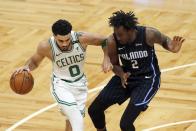 Boston Celtics' Jayson Tatum (0) drives past Orlando Magic's Al-Farouq Aminu (2) during the first half on an NBA basketball game, Sunday, March 21, 2021, in Boston. (AP Photo/Michael Dwyer)