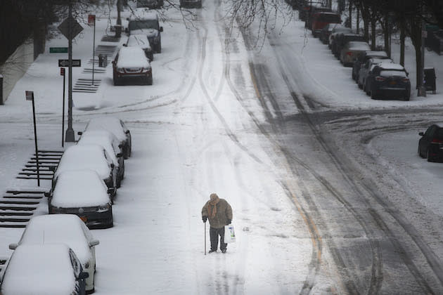 NEW YORK, NY – MARCH 14: An elderly man with a cane struggles in the sleet and snow on March 14, 2017 in New York City. New York City and New Jersey are under a state of emergency as a blizzard is expected to bring over one foot of snow and high winds to the area. Schools, flights, businesses and public transportation are closed or restricted throughout the area. (Photo by Spencer Platt/Getty Images)