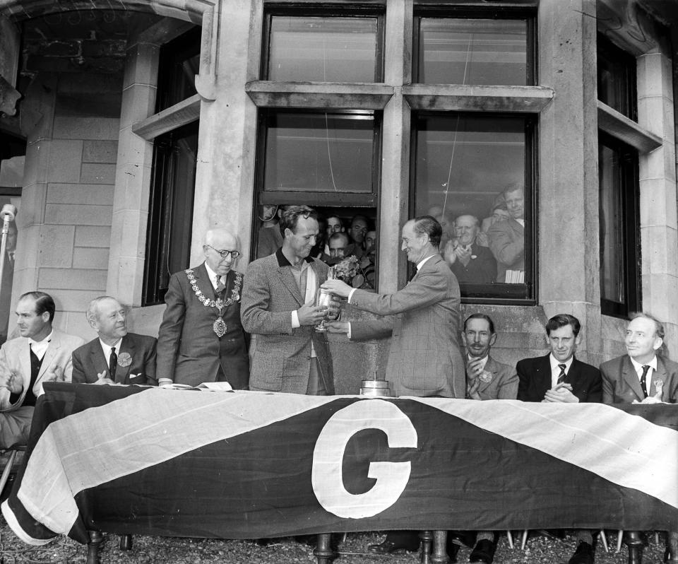 <p>Arnold Palmer is pictured receiving the Claret Jug following his victory with a four round aggregate of 276 shots (Photo by Bob Thomas/Getty Images) </p>