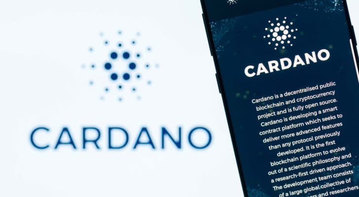 The Cardano logo and description on a smartphone.