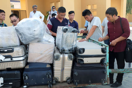 Chinese workers are seen after arriving at Gwadar airport in Gwadar, Pakistan October 3, 2017. Picture taken October 3, 2017. REUTERS/Drazen Jorgic