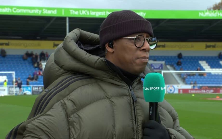 Ian Wright in giant coat