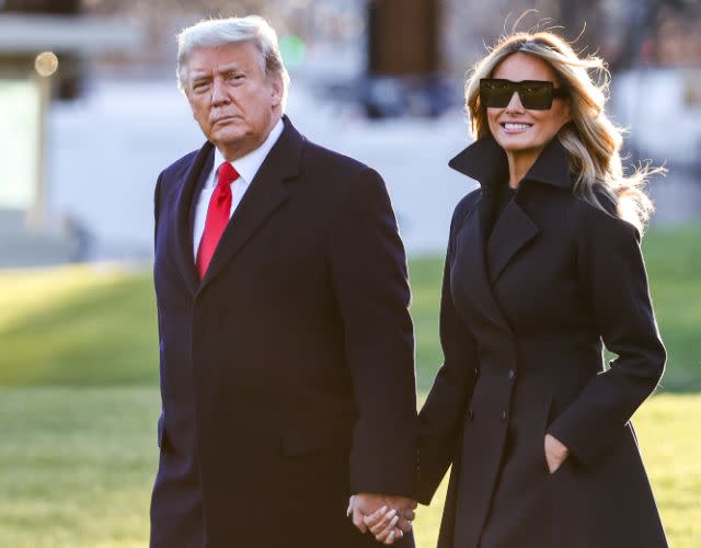 WASHINGTON, DC – DECEMBER 23: President Donald Trump and first lady Melania Trump walk on the south lawn of the White House on December 23, 2020 in Washington, DC. The Trumps are headed to Mar-a-Lago for the holidays with a government shutdown possible on Monday December 28. (Photo by Tasos Katopodis/Getty Images)