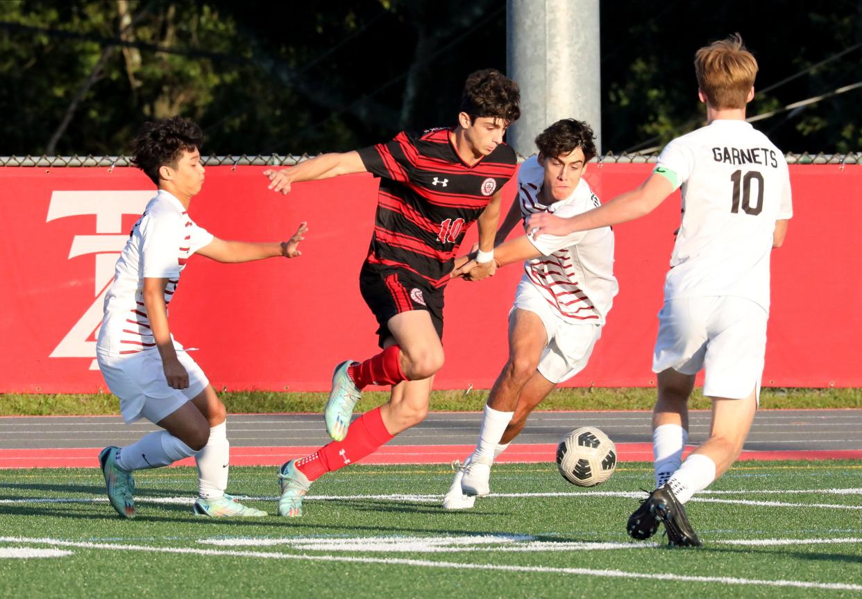 Tappan Zee's Brady Jacobs moves the ball in front of Rye's Kaden Zion during their boys soccer game at Tappan Zee High School, Sept. 19, 2023.