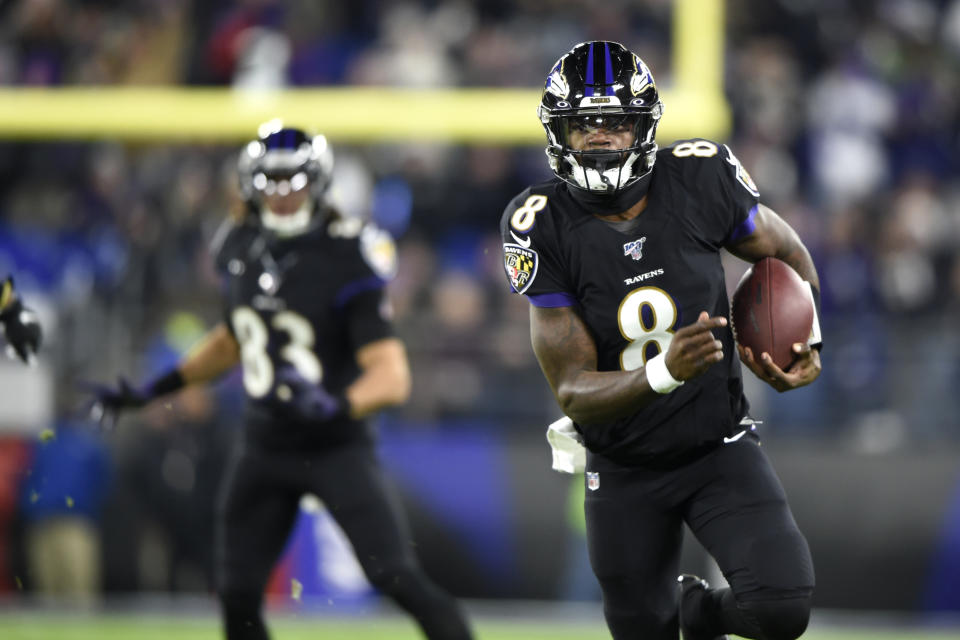 Baltimore Ravens quarterback Lamar Jackson (8) scrambles for yardage against the New York Jets during the first half of an NFL football game, Thursday, Dec. 12, 2019, in Baltimore. (AP Photo/Gail Burton)