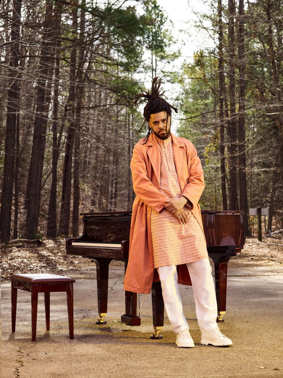 <cite class="credit">Coat, $1,235, by Dries Van Noten / Kurta, $150, and pants, $35, by Vintage India / Sneakers, $150, by Camper / Ring (throughout), stylist's own<br> Yamaha Piano courtesy of Ruggero Piano</cite>
