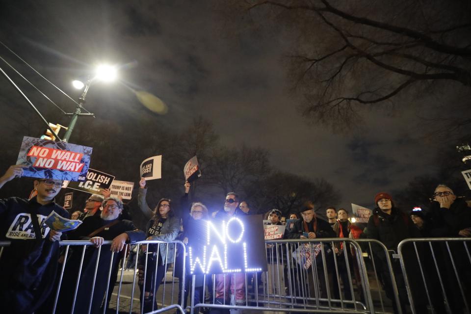 Protesters of President Donald Tump's national emergency declaration gather outside Trump International Hotel & Tower on Friday, Feb. 15, 2019, in New York. Some people have been arrested at the protest. The NYPD wasn't immediately able to say how many people were taken into custody. (AP Photo/Frank Franklin II)