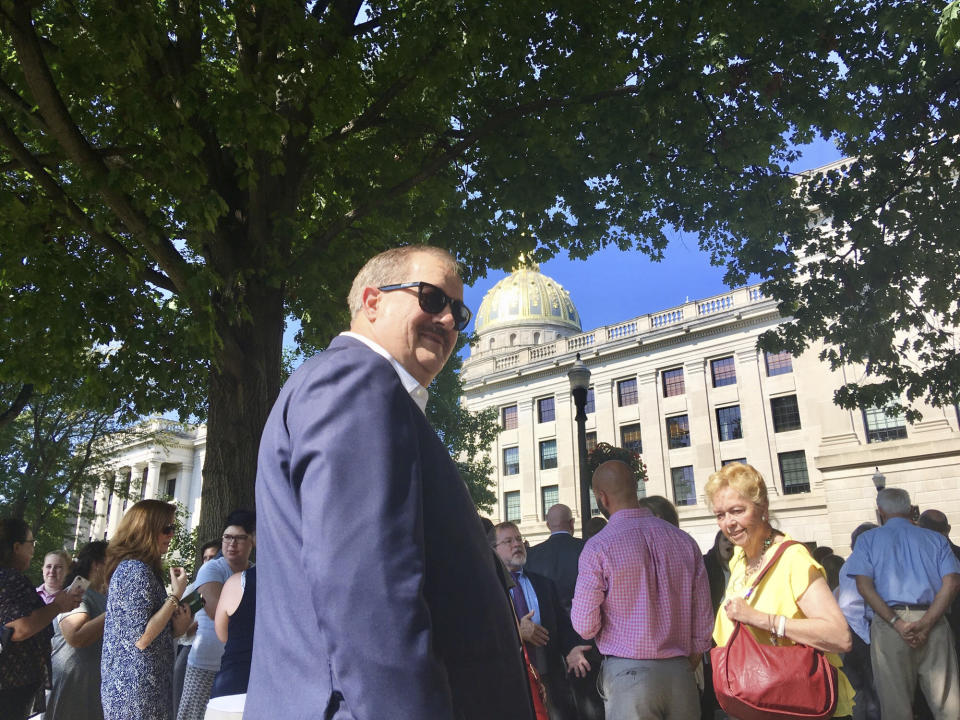 FILE - Former coal executive Don Blankenship waits outside the West Virginia Capitol on Wednesday, Aug. 29, 2018, after the Capitol was evacuated due to a fire alarm in Charleston, W.Va. Three reporters from a Pulitzer Prize-winning newspaper in West Virginia have been fired after publicly criticizing a now-removed video interview posted on their parent company's website with a former coal executive who was convicted of a safety violation in connection with the worst U.S. mine disaster in decades. (AP Photo/John Raby, File)