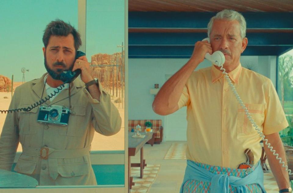 A still from Asteroid City of two men on the phone in different locations