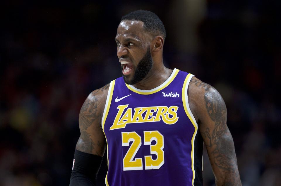 Los Angeles Lakers forward LeBron James reacts after scoring against the Portland Trail Blazers during the first half of an NBA basketball game in Portland, Ore., Friday, Dec. 6, 2019. (AP Photo/Craig Mitchelldyer)