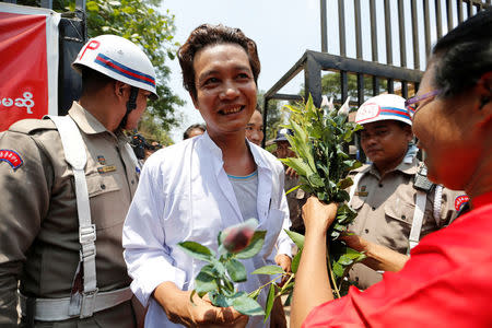 Newly released prisoners, part of over 8,000 inmates granted amnesty by Myanmar's President Win Myint to mark Myanmar's new year, walk out from Insein prison in Yangon, Myanmar April 17, 2018. REUTERS/Ann Wang