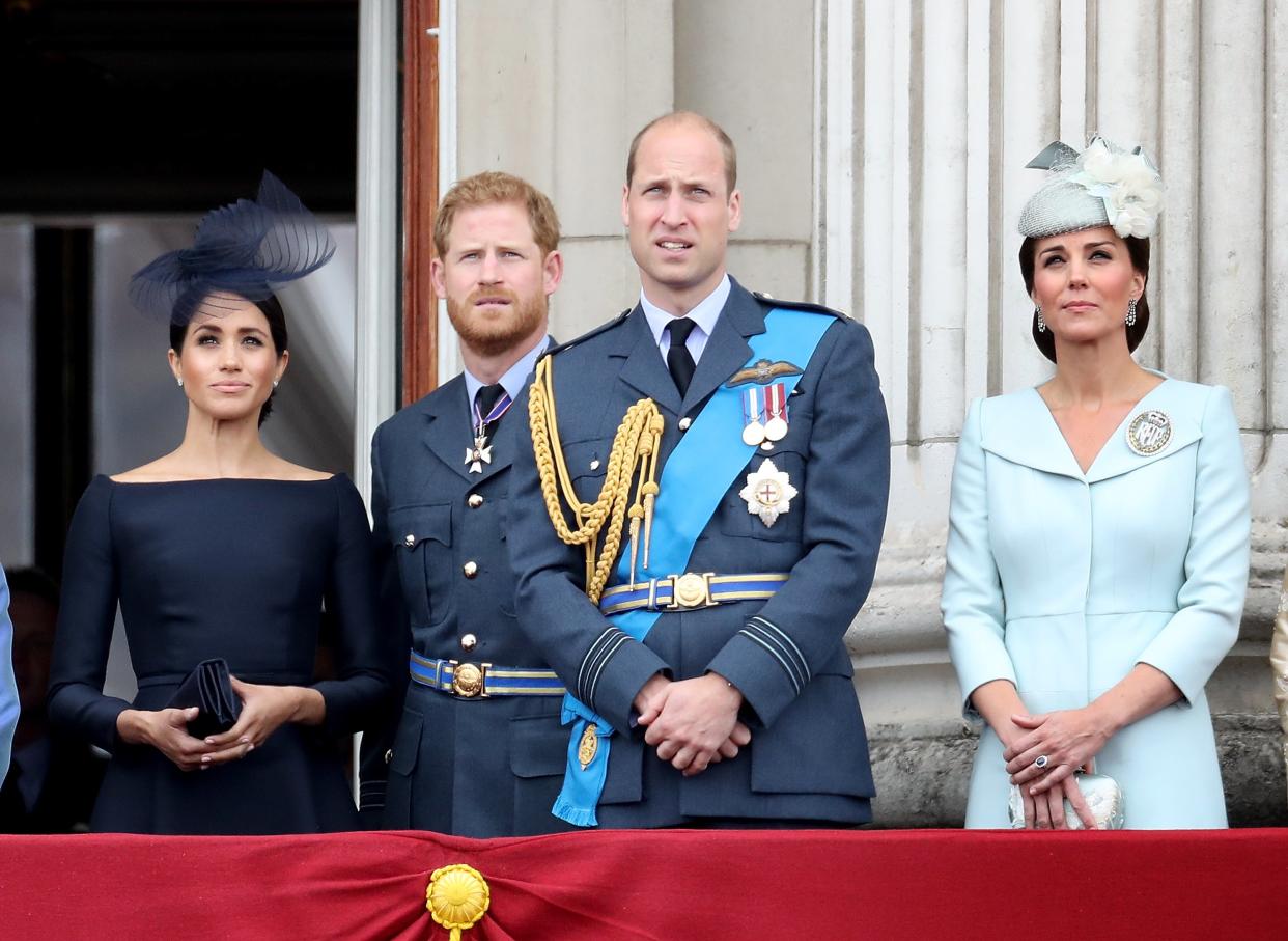 Meghan, Duchess of Sussex, Prince Harry, Duke of Sussex, Prince William, Duke of Cambridge and Catherine, Duchess of Cambridge watch the RAF flypast on the balcony of Buckingham Palace, as members of the Royal Family attend events to mark the centenary of the RAF on July 10, 2018 in London, England.   (Chris Jackson/Getty Images)