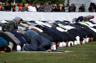 People perform the Friday prayers at Hagley Park outside Al-Noor mosque in Christchurch, New Zealand March 22, 2019. REUTERS/Edgar Su