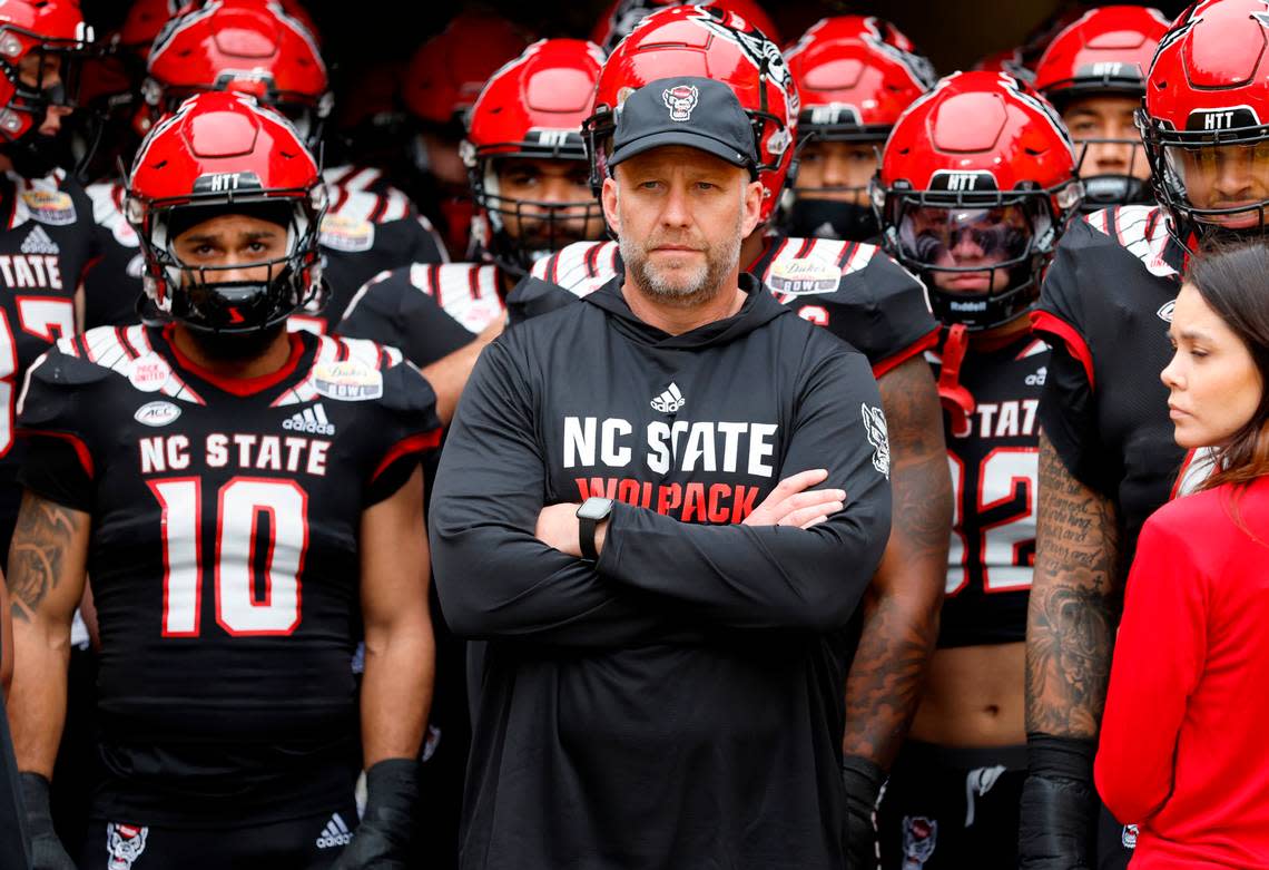 N.C. State head coach Dave Doeren prepares to lead his team out onto the field before N.C. State’s game against Maryland in the Duke’s Mayo Bowl at Bank of America Stadium in Charlotte, N.C., Friday, Dec. 30, 2022.