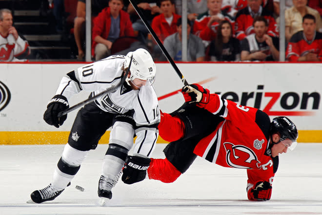 NEWARK, NJ - JUNE 09: Zach Parise #9 of the New Jersey Devils falls to the ice against Mike Richards #10 of the Los Angeles Kings during Game Five of the 2012 NHL Stanley Cup Final at the Prudential Center on June 9, 2012 in Newark, New Jersey. (Photo by Bruce Bennett/Getty Images)