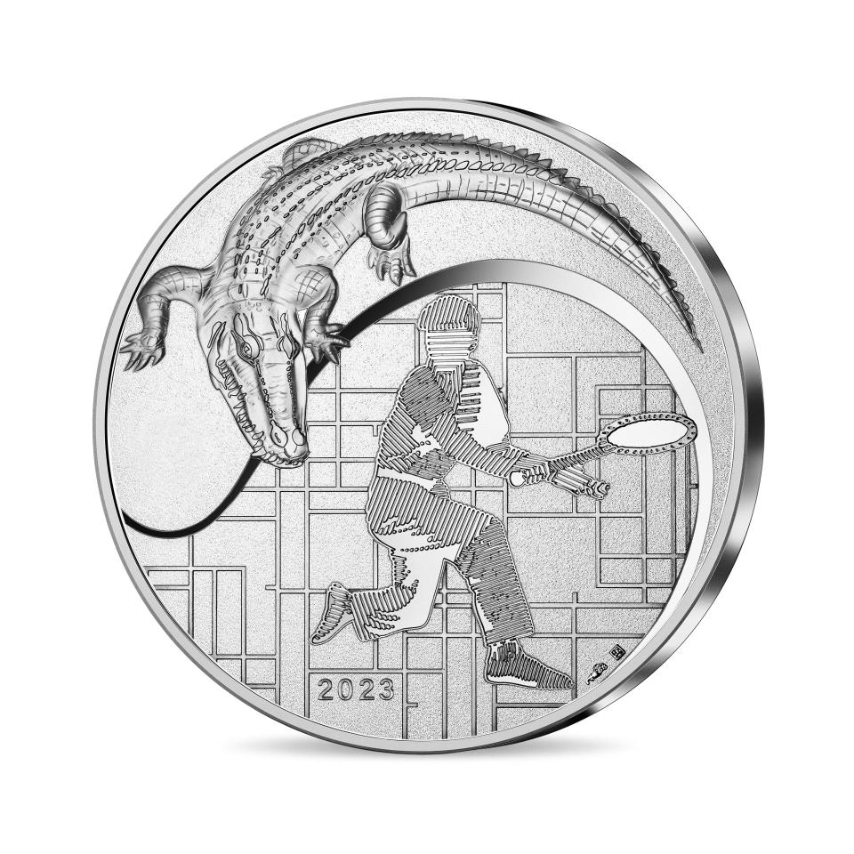 A silver coin by La Monnaie de Paris for Lacoste.