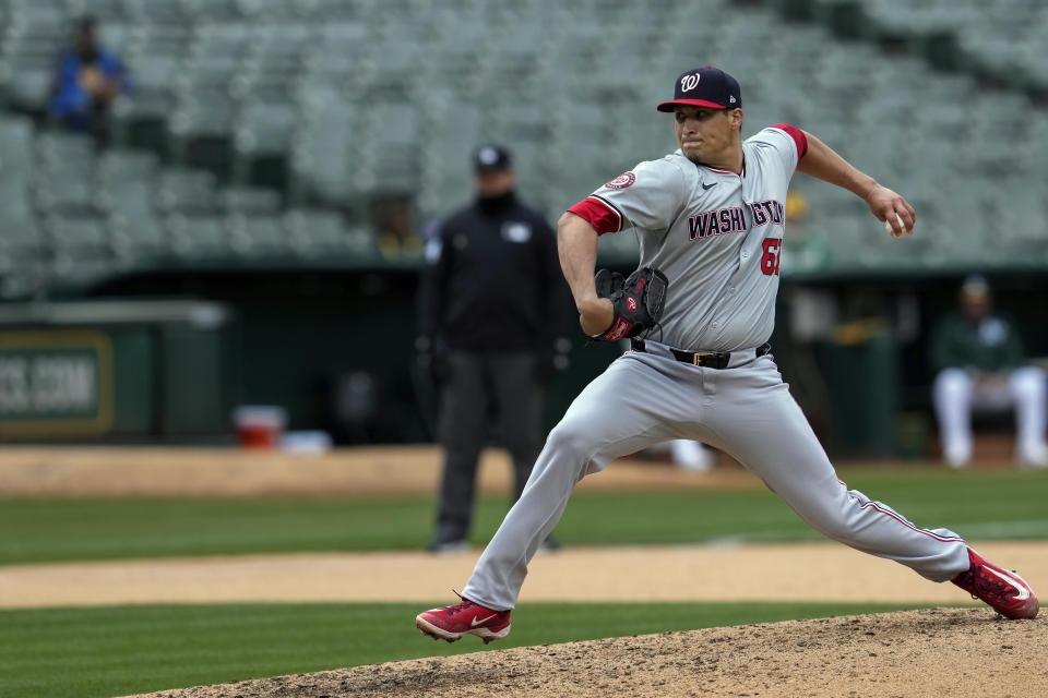 Washington Nationals pitcher Robert Garcia throws to an Oakland Athletics batter during the seventh inning of a baseball game Saturday, April 13, 2024, in Oakland, Calif. (AP Photo/Godofredo A. Vásquez)