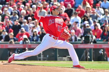 Feb 24, 2018; Tempe, AZ, USA; Los Angeles Angels pitcher Shohei Ohtani (17) throws the first pitch of the game during the first inning against the Milwaukee Brewers at Tempe Diablo Stadium. Mandatory Credit: Matt Kartozian-USA TODAY Sports