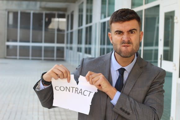 Man ripping up a contract