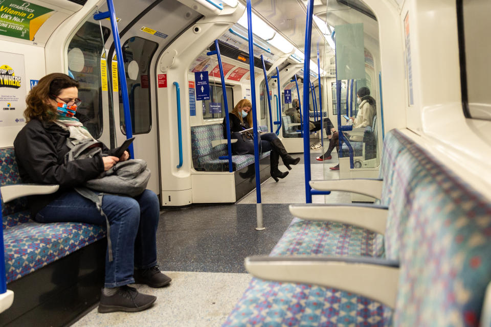 Londoners in protective face masks are seen commuting in London Tube as the UK's government introduced strict Coronavirus restrictions - tier 4 Stay at Home policy - earlier this month due to increased number of Covid-19 cases in the UK - London, England on January 22, 2021. Only essential shops can be opened. Exercising and going to work are exceptions in Stay at Home policy. Everyone must wear a face mask in public places. (Photo by Dominika Zarzycka/NurPhoto via Getty Images)