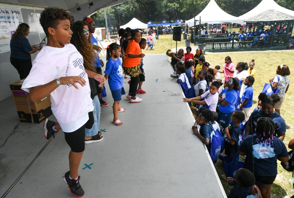 Jeremiah Stoddard (left), 11, of the Frontline after school summer camp, participates in a dance contest during the 4th annual Unity in our Community event hosted by the Fort Pierce Police Department at the Fort Pierce Recreation Center on Wednesday, July 6, 2022, in Fort Pierce. "It's really really fun and like it gets me energetic and it makes me happy," Jeremiah said about dancing.