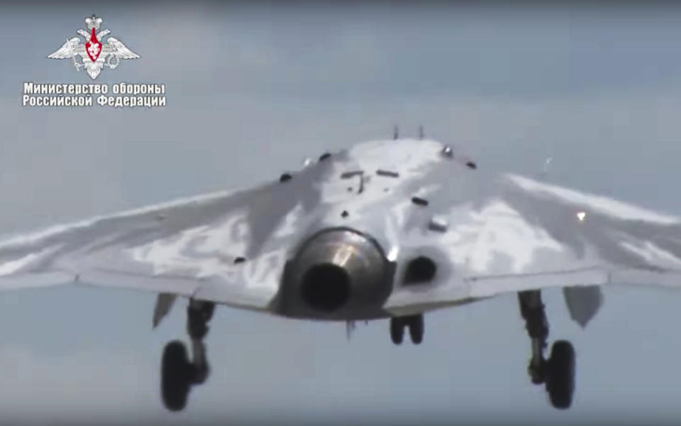 In this video grab made available on Wednesday, Aug. 7, 2019 by Russian Defense Ministry Press Service, Russia's military drone Okhotnik is seen taking off at an unidentified location in Russia. The ministry said the drone, which has stealth capabilities and is equipped with advanced reconnaissance equipment, made its maiden flight Saturday. (Russian Defense Ministry Press Service via AP)