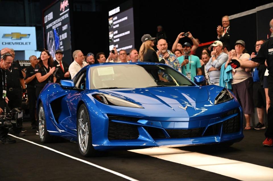 A front three-quarter view of 2024 Chevrolet Corvette E-Ray in Riptide Blue crossing the auction block at the 2023 Barrett-Jackson Palm Beach auction.