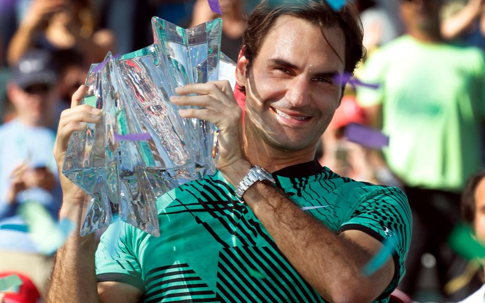 Roger Federer gets his hands on the Indian Wells trophy