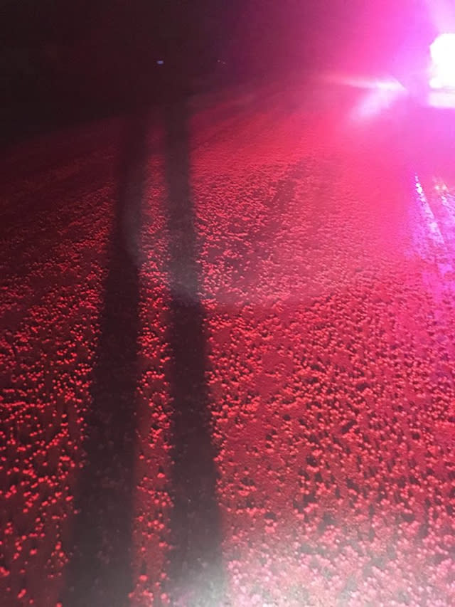 Thousands of Skittles turn road a sea of red