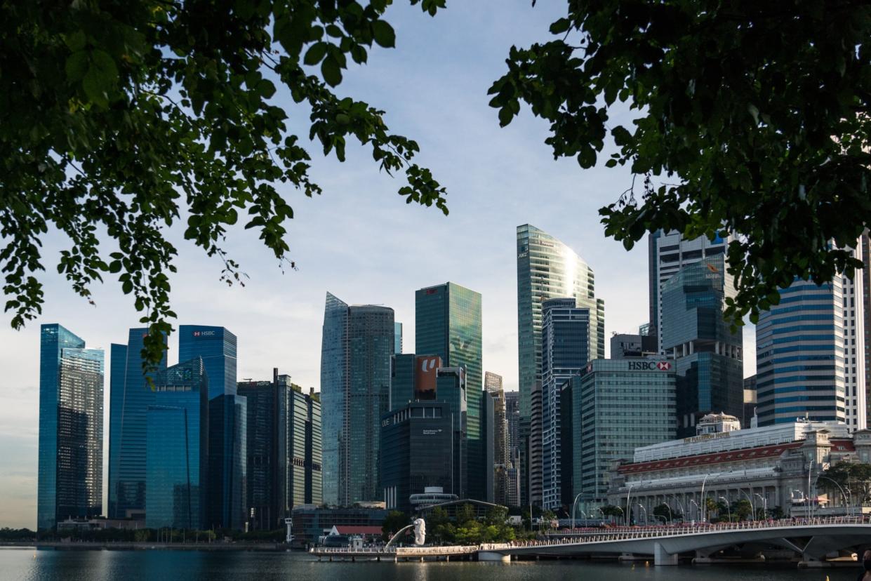 The Merlion Statue and Jubilee Bridge stand in front of the city skyline on Wednesday, May 20, 2020. Office rents in Singapore reached a 15-year high in the first quarter.