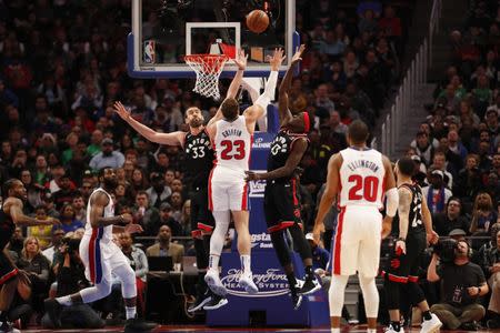 Mar 17, 2019; Detroit, MI, USA; Detroit Pistons forward Blake Griffin (23) shoots against Toronto Raptors center Marc Gasol (33) and forward Pascal Siakam (43) during the fourth quarter at Little Caesars Arena. Mandatory Credit: Raj Mehta-USA TODAY Sports