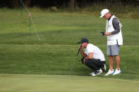 Brooks Koepka of the United States lines up his putt on the 17th hole during the final round of the CJ Cup PGA golf tournament at Nine Bridges on Jeju Island, South Korea, Sunday, Oct. 21, 2018. (Park Ji-ho/Yonhap via AP)