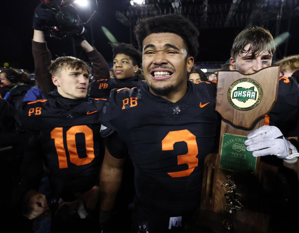 Massillon senior linebacker Dorian Pringle (3) celebrates after the Tigers' win over Hoban in the OHSAA Division II state championship, Thursday, Nov. 30, 2023, in Canton.