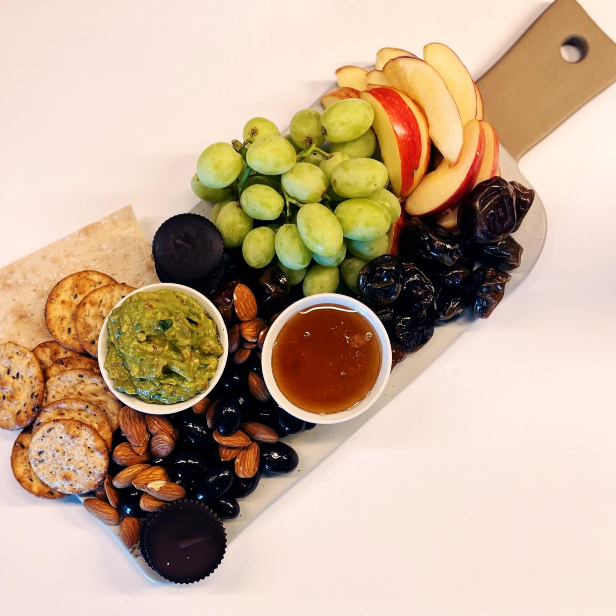 Guacamole and vegan honey are the star dipping-items on this charcuterie board. (Photo: Adylia-Rhenee Gutierrez)