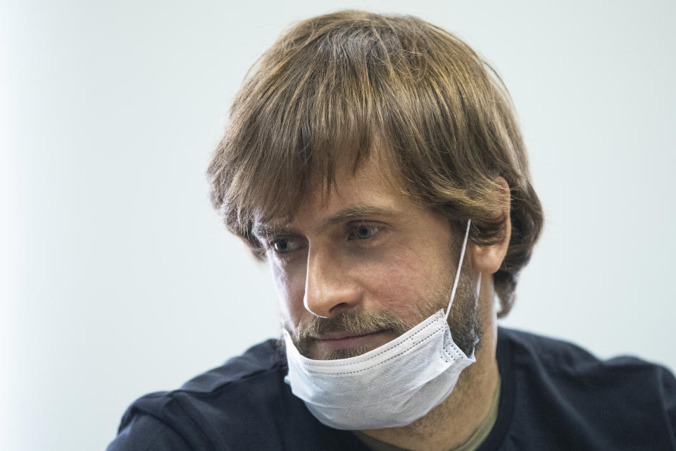 Pyotr Verzilov, prominent member of the protest group Pussy Riot waits for his court hearing in a court in Moscow, Russia, Thursday, June 25, 2020. Moscow City Court on Thursday rejected the appeal Verzilov filed to contest a 15-day administrative arrest handed to him for swearing in public earlier this week. Kremlin critics believe Verzilov's arrest to be politically motivated. (AP Photo/Pavel Golovkin)
