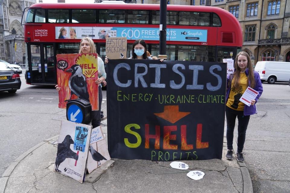 Demonstrators outside Central Hall in Westminster where Shell was holding its annual general meeting (PA Wire)