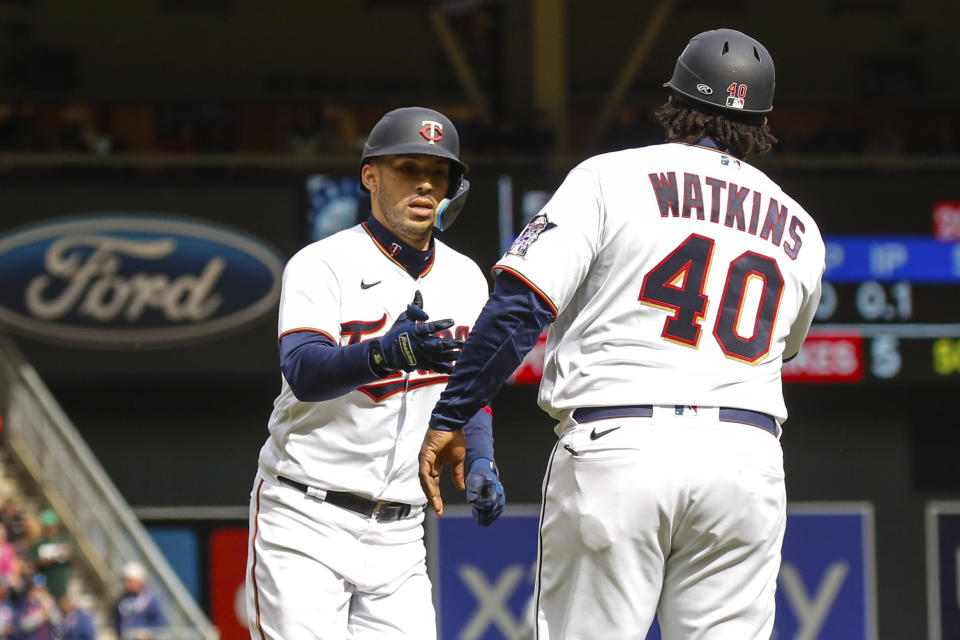 Minnesota Twins' Carlos Correa (4) rounds third base on a solo home run against the Seattle Mariners during the sixth inning of a baseball game, Sunday, April 10, 2022, in Minneapolis. (AP Photo/Nicole Neri)