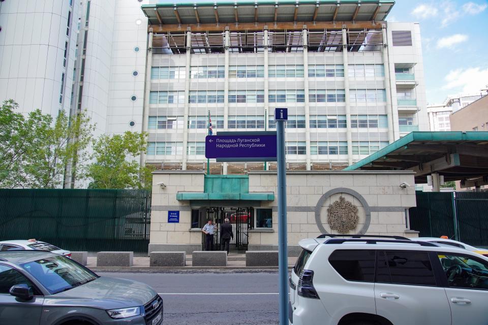 A sign reading "Luhansk People's Republic Square" is set outside the British embassy in Moscow, Russia, Friday, July 8, 2022. Moscow Mayor Sergei Sobyanin signed the decree naming the stretch outside the embassy after the Luhansk People's Republic. (Alexander Avilov, Moscow News Agency photo via AP)