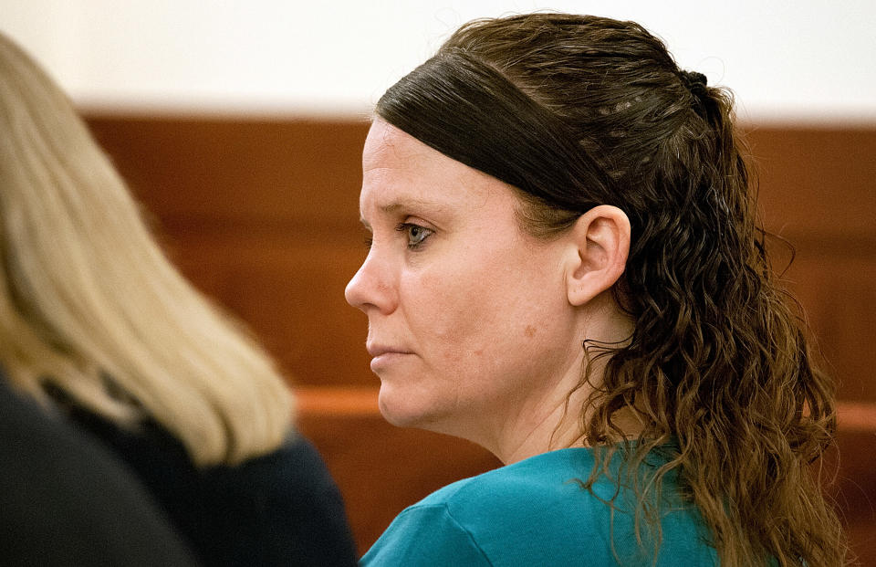 Julie Corey listens as Judge Janet Kenton-Walker instructs the jury during her murder trial in Worcester Superior Court in Worcester, Mass. Tuesday Feb. 11, 2014. Corey is charged with killing her pregnant friend and cutting the baby from her womb. (AP Photo/Worcester Telegram & Gazette, Rick Cinclair, Pool)