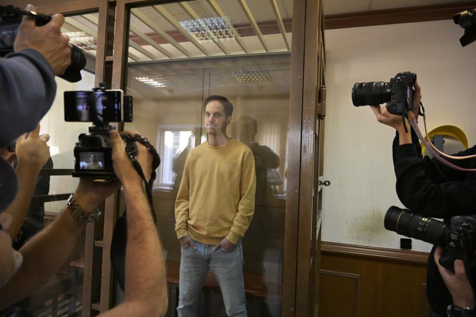 FILE - Wall Street Journal reporter Evan Gershkovich stands in a defendants’ cage at a hearing in Moscow, Russia, on Tuesday, Sept. 19, 2023. Gershkovich has been jailed since March 2023 on espionage charges, which he, his employer and the U.S. government all deny. (AP Photo/Dmitry Serebryakov, File)