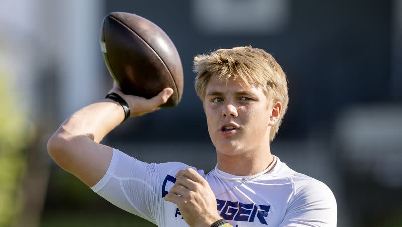 Isaac Wilson tosses the ball back and forth with a teammate before a seven-on-seven tourney game in Layton on Friday, June 9, 2023. Wilson, a younger brother of BYU star Zach Wilson, recently announced he will be playing his college football for the rival Utes.