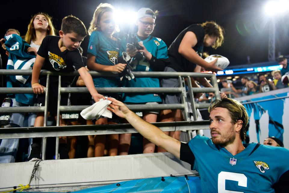 Jacksonville Jaguars quarterback Jake Luton #6 hands off his headband to a young fan after the game of a preseason NFL game Friday, Aug. 12, 2022 at TIAA Bank Field in Jacksonville. The Cleveland Browns defeated the Jacksonville Jaguars 24-13. [Corey Perrine/Florida Times-Union]
