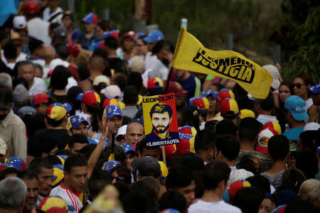 A placard depicting jailed Venezuelan opposition leader Leopoldo Lopez is seen during a rally in support of political prisoners and against Venezuelan President Nicolas Maduro, outside the military prison of Ramo Verde, in Los Teques, Venezuela April 28, 2017. REUTERS/Marco Bello