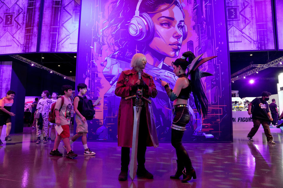 Gaming fans dressed in cosplay outfits attend the Dubai Esports and Games Festival in Dubai, United Arab Emirates, Saturday, June 24, 2023. Saudi Arabia, the new home of some of soccer’s biggest stars and a co-owner of professional golf, is proving to be no less ambitious when it comes to another global pastime, the $180 billion-a-year video game industry. (AP Photo/Kamran Jebreili)