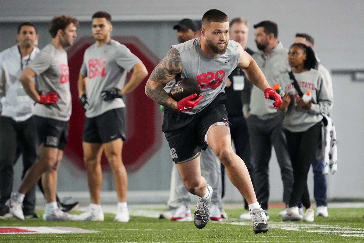 Mar 20, 2024; Columbus, Ohio, USA; Ohio State Buckeyes tight end Cade Stover runs during Pro Day at the Woody Hayes Athletic Center.
