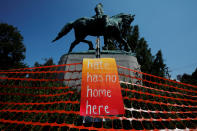 <p>A sign reading “Hate Has No Home Here” hangs by the statue of Civil War Confederate General Robert E. Lee, ahead of the one year anniversary of 2017 Charlottesville “Unite the Right” protests, in Charlottesville, Va., Aug. 10, 2018. (Photo: Brian Snyder/Reuters) </p>