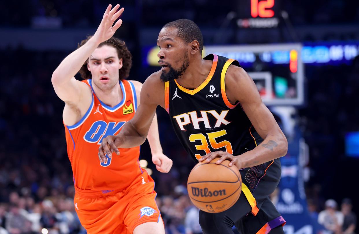 Phoenix Suns' Kevin Durant (35) drives past Oklahoma City Thunder's Josh Giddey (3) during the NBA basketball between the Oklahoma City Thunder and the Phoenix Suns at Paycom Center in Oklahoma City, Friday, March 29, 2024.