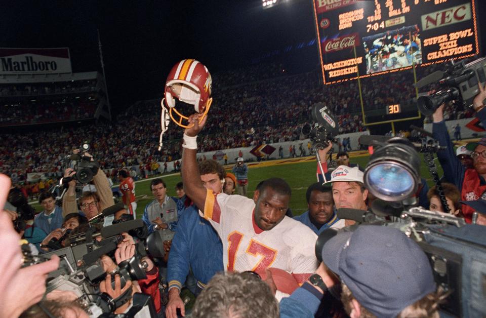 Washington quarterback Doug Williams celebrated after winning Super Bowl XXII in 1988 beating the Denver Broncos, 42-10.